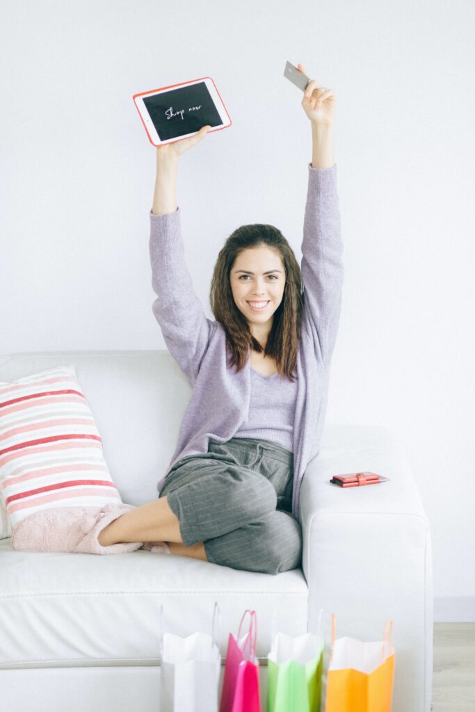 happy girl holding a credit card